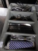 *grey cutlery tray with cutlery assortment