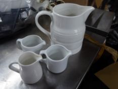 *selection of S/S milk jugs x 4