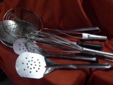 *S/S kitchen utensils x 7 including spiders, whisk and fish slice