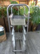 *S/S tray trolley with approx. 30 black trays