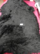 *Rug (as per photograph)