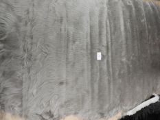 *Rug (as per photograph)