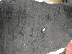 *Rug (as per photograph)