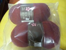 Two Large Rolls of Red Wool