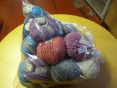 Twenty Five Small Rolls of Wool