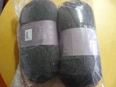 Two Large Rolls of Dark Green Wool