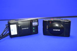 Two Olympus Cameras AM-100 and XA2