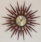 1 x Newgate Pluto Starburst Wall Clock - Cosmic Timepiece With Wooden Rays