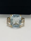 14ct Yellow Gold Aquamarine and Diamond ring featuring centre, cushion cut Aquamarine (5.25ct), claw