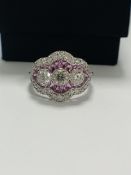 18ct White Gold Sapphire and Diamond ring featuring centre, 3 round brilliant cut Diamonds (0.50ct),