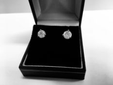 2.00ct Solitaire diamond stud earrings set with brilliant cut diamonds which have been enhanced.