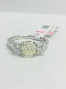 1t Cushion cut diamond Trilogy ring set in a platinum setting