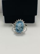 14ct White Gold Aquamarine and Diamond ring featuring centre, oval cut Aquamarine (3.16c), claw set,
