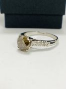 Platinum Diamond ring featuring centre, round brilliant cut, champagne Diamond (2.00ct), claw set, w