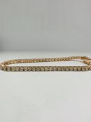 14ct Rose Gold Diamond tennis bracelet featuring, 59 round brilliant cut Diamonds (5.20ct TDW), claw