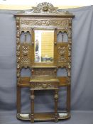 CIRCA 1900 CARVED OAK HALL STAND with mask and fruit detail, central glove drawer and base shelf