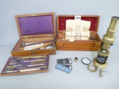 MAHOGANY CASED BRASS FIELD MICROSCOPE with slides and a cased set of drawing instruments