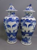 19TH CENTURY PAIR OF CHINESE BLUE & WHITE BALUSTER VASES & COVERS, 37cm heights painted with