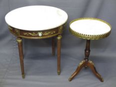 TWO EMPIRE STYLE MARBLE TOPPED CIRCULAR SIDE TABLES with gilt metal mounts, 60 and 57cm heights,