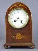 MAHOGANY MANTEL CLOCK with inlay detail on brass ball feet