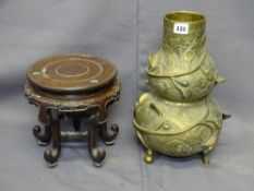 ORIENTAL BRONZE DOUBLE GOURD VASE on carved hardwood stand, high relief surrounding vine against