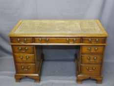 REPRODUCTION MAHOGANY TWIN-PEDESTAL DESK with gilt tooled insert leather top and swan neck handles