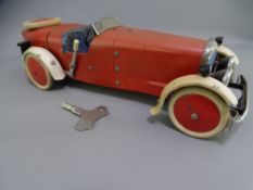 MECCANO CLOCKWORK MOTOR CAR WITH KEY, red and cream livery with blue seat and grill, Meccano