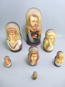HAND PAINTED RUSSIAN NESTING DOLLS, set of seven, depicting Tsar Nicholas II and his family