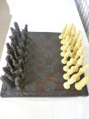 CAST COMPOSITION ORIENTAL STYLE CHESS SET & BOARD