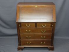REPRODUCTION MAHOGANY FALL-FRONT BUREAU having a well fitted and shaped interior of pigeon holes,