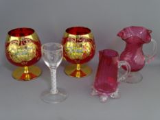 EARLY AIR TWIST STEM DRINKING GLASS, two cranberry jugs and a pair of Italian ruby and gilt brandy