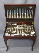 REPRODUCTION MAHOGANY TABLE CANTEEN of Cooper Ludlam and other cutlery, mainly EPNS, the table top