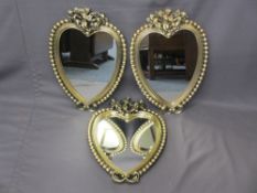 THREE BOBBLE & CHERUBIC GILT DECORATED HEART SHAPED WALL MIRRORS, 59 x 43cm measurements (damage
