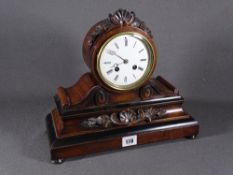 MAHOGANY MANTEL CLOCK with carved detail on four feet