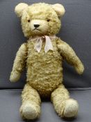 GOLD PLUSH VINTAGE TEDDY BEAR with moveable limbs, 80cms length, playworn condition