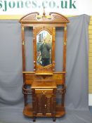REPRODUCTION MAHOGANY HALL STAND, mirrored centre with brass hooks and shelf above a single