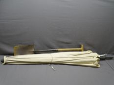 GARDEN PARASOL (appears new) with a non-matching base and a garden spade