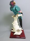 G ARMANI FOR CAPODIMONTE PORCELAIN PARROT, Majolica style, satin and gilt glazes to the bird perched