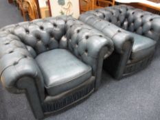 TWO BLUE LEATHER EFFECT CHESTERFIELD TYPE ARMCHAIRS, 62cms H, 100cms W, 61cms seat depth