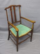 EDWARDIAN MAHOGANY ARMCHAIR having slight Art Nouveau detail and upholstered seat, 97cms H, 58cms