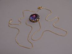 UNTESTED YELLOW METAL LARGE AMETHYST PENDANT ON 500 STAMPED NECKLACE, 28.5cms overall L, 16mm