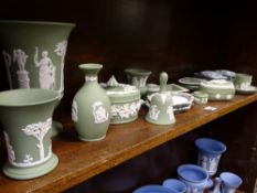 WEDGWOOD GREEN JASPERWARE, 15 pieces, a pair of lidded boxes and a pair of pin trays, similarly