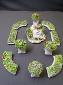 LUIGI FABRIS ITALIAN PORCELAIN DISPLAY SET, 11 piece consisting of central seated girl holding