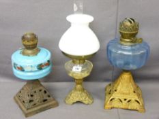 THREE CIRCA 1900 CAST IRON & COLOURFUL GLASS OIL LAMPS