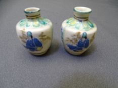 MINIATURE JAPANESE SATSUMA VASES, a pair, unusual palette with character marks to the base, 6cm