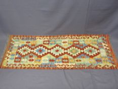 VEGETABLE DYE WOOL CHOBI KILIM RUNNER - vibrant stylized multicolour pattern within a double border,