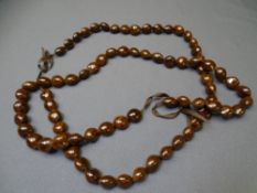 TWO LARGE HEART SHAPED PASSION BEAD NECKLACES, 105cm lengths approx