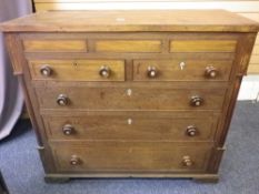 CIRCA 1830 ANGLESEY OAK & MAHOGANY CHEST OF DRAWERS having three secret top drawers over two short