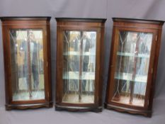 THREE REPRODUCTION MAHOGANY WALL HANGING CORNER DISPLAY CABINETS, cut glass single doors and