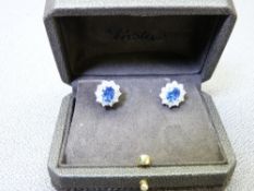 DIAMOND & SAPPHIRE EARRINGS - a fine pair of oval 18ct cluster earrings having a centre oval